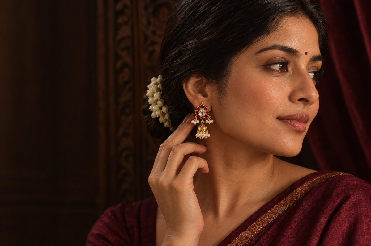 Model wearing the Pratha Red Kundan Jhumkis