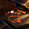 Silver Pearl Beads Rakhi – styled photo