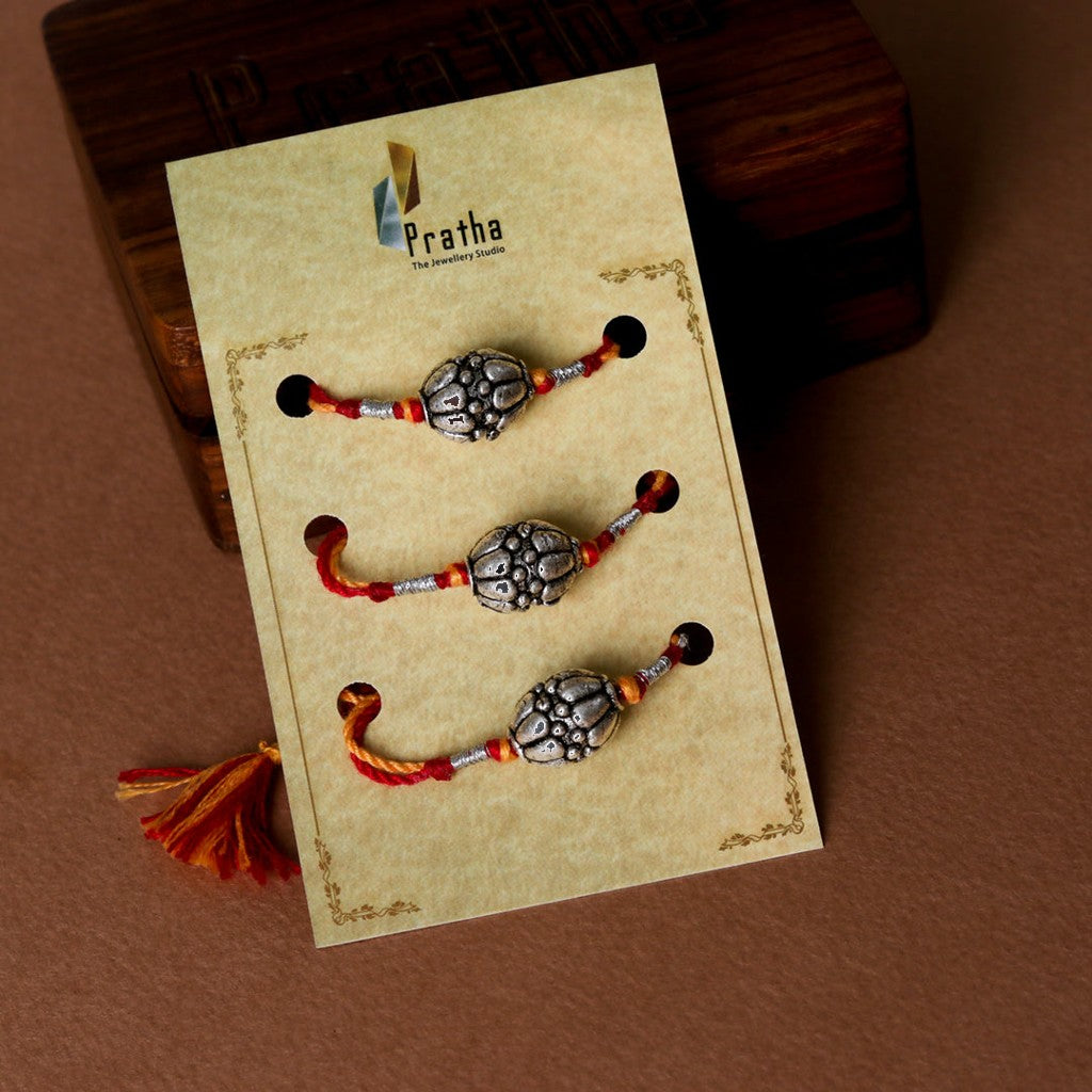 Silver Round Beads Rakhis ( Pack Of 3 ) – styled photo