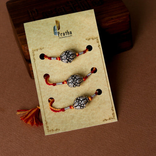 Silver Round Beads Rakhis ( Pack Of 3 ) – styled photo